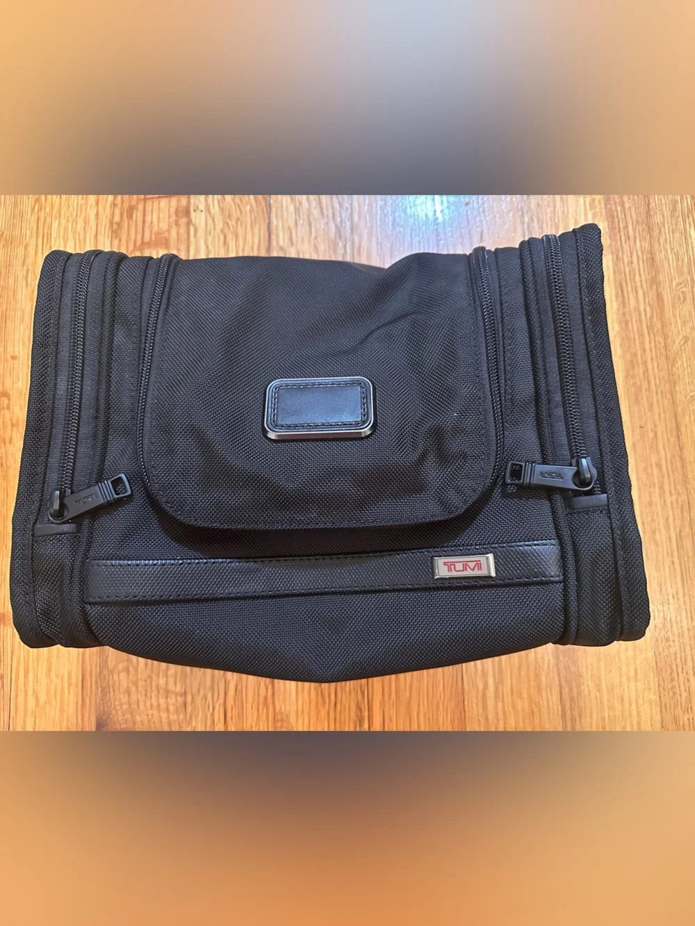 Tumi  hanging travel kit  with hook for hanging.